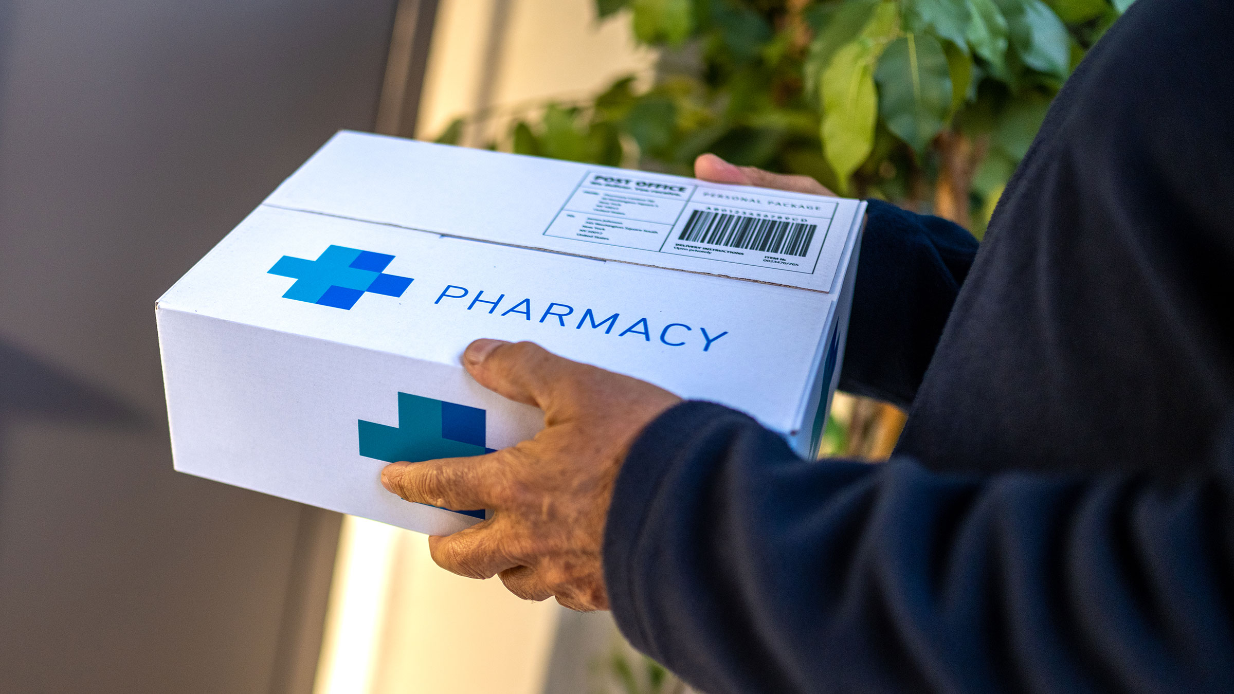 MedXpert Pharmacy delivery partner delivering genuine medicines to a customer's doorstep in Indore, India — 24x7 local delivery and international pharmacy shipping to USA, UK, UAE, Canada